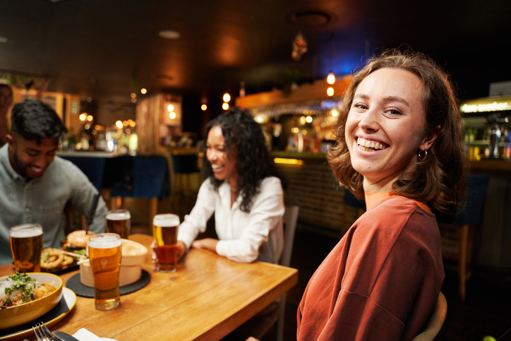 Woman smiling at dinner