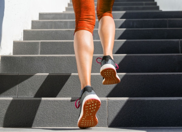 a person is walking up a set of stairs