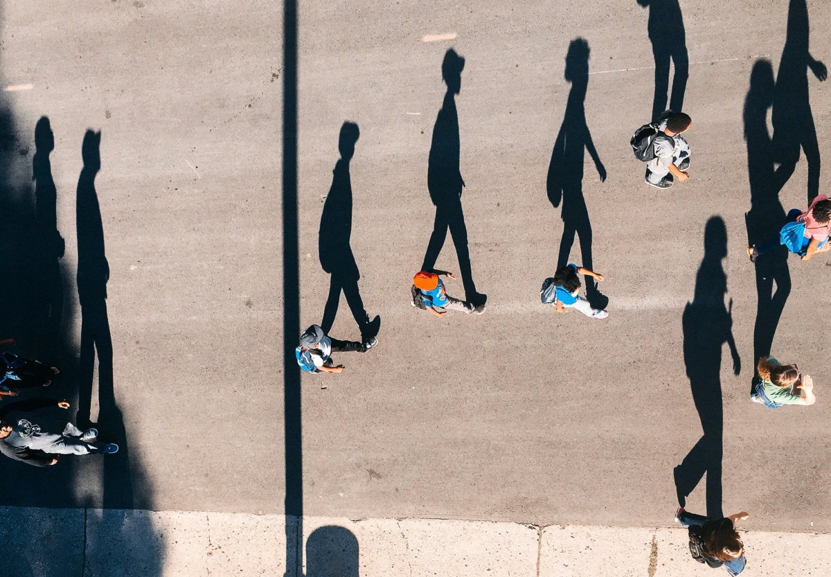 Top down view of people walking on the street.